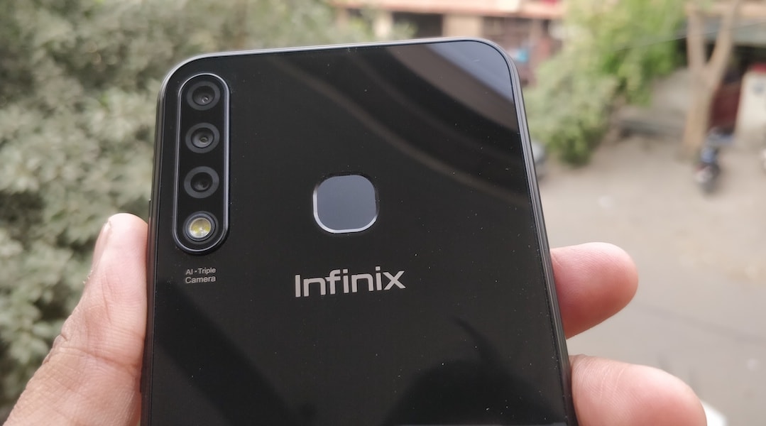 Infinix Smart 3 Plus (X627V) is a feature-packed entry-level budget mobile phone, it has a triple rear camera, 6.21 inches HD+ display, MediaTek A22 Quad Core 2.0GHz processor and 3500 mAh Li-ion Polymer Battery. If I am not wrong then Infinix Smart 3 Plus (X627V) is the only mobile phone in the price range of Rs. 7k which comes with the three rear camera lens setup. Infinix has launched the Smart 3 Plus in a segment which is the most crowded mobile phone segment in India. In sub 10k segment there are too many phones probably more than any other segment, I shouldn't be surprised if I visited offline mobile phone store and came to know about few mobile phone brands which I never heard before. There are many companies and many brands in the sub 10k segment specially in offline mobile phone market which are launching the devices on a regular basis and also people are actually buying it based on the recommendation of store's salesperson. Infinix is an online-only brand of Transsion Holding and other brands of the company are TECNO and iTel. Infinix Smart 3 Plus is going to be available online only and it will the direct combat with the entry-level Xiaomi Redmi and Realme phones. Xiaomi Redmi phones and Realme C series phones are doing really well in this sub 10k segment in India but Infinix Smart 3 Plus is going to play a challenging role in the battle. Let's take look at the key specification of Infinix Smart 3 Plus (X627V). <h2>Key Specifications of Infinix Smart 3 Plus (X627V):</h2> <table id="tablepress-1572" class="tablepress tablepress-id-1572 tablepress-responsive-phone" width="679"> <thead> <tr class="row-1 odd"> <th class="column-1"></th> <th class="column-2"> <h5><span style="color: #ffffff;">Infinix Smart 3 Plus (X627V)</span></h5> </th> </tr> </thead> <tbody class="row-hover"> <tr class="row-2 even"> <td class="column-1"><strong> Display</strong></td> <td class="column-2"> <ul> <li>6.2-inch HD+ IPS LCD</li> <li>720 x 1520 resolution</li> <li>19:9 aspect ratio</li> <li>~269 PPI</li> <li>88% screen-to-body ratio</li> <li>Waterdrop display notch</li> </ul> </td> </tr> <tr class="row-3 odd"> <td class="column-1"><strong>Processor</strong></td> <td class="column-2"> <ul> <li>MediaTek MT6761 Helio A22 (12 nm)</li> <li>Quad-core 2.0 GHz Cortex-A53</li> </ul> </td> </tr> <tr class="row-4 even"> <td class="column-1"><strong>GPU</strong></td> <td class="column-2"> <ul> <li>PowerVR GE8320</li> </ul> </td> </tr> <tr class="row-5 odd"> <td class="column-1"><strong>RAM</strong></td> <td class="column-2"> <ul> <li>2GB</li> </ul> </td> </tr> <tr class="row-6 even"> <td class="column-1"><strong>Storage</strong></td> <td class="column-2"> <ul> <li>32GB</li> <li>Expandable up to 256 GB; Dedicated MicroSD card slot</li> </ul> </td> </tr> <tr class="row-7 odd"> <td class="column-1"><strong>Primary Camera</strong></td> <td class="column-2"> <ul> <li>AI Triple Camera</li> <li>13MP (f/1.8) + 2MP + Low Light Sensor</li> <li>PDAF, AR Stickers, AI Portrait, HDR, Night Mode, Beauty Mode</li> <li>Dual LED Flash</li> <li>1080p@30fps video recording</li> </ul> </td> </tr> <tr class="row-8 even"> <td class="column-1"><strong>Selfie Camera</strong></td> <td class="column-2"> <ul> <li>8MP, f/2.0</li> <li>AR Stickers, Beauty, Portrait, HDR</li> <li>Screen Flash</li> </ul> </td> </tr> <tr class="row-9 odd"> <td class="column-1"><strong>Battery</strong></td> <td class="column-2"> <ul> <li>3,500mAh, Non-removable Li-Po</li> </ul> </td> </tr> <tr class="row-10 even"> <td class="column-1"><strong>Audio </strong></td> <td class="column-2"> <ul> <li>3.5mm Audio Jack</li> <li>Speakers</li> </ul> </td> </tr> <tr class="row-11 odd"> <td class="column-1"><strong>Connectivity</strong></td> <td class="column-2"> <ul> <li>Dual Nano SIM, 4G VoLTE</li> <li>Bluetooth 5.0, Wi-Fi, Hotspot, GPS, FM Radio</li> <li>3.5mm jack, microUSB 2.0, USB On-The-Go,</li> </ul> </td> </tr> <tr class="row-12 even"> <td class="column-1"><strong>Sensors</strong></td> <td class="column-2"> <ul> <li>Fingerprint sensor - Rear Mounted</li> <li>G-sensor, Proximity Sensor, Light Sensor, Compass</li> </ul> </td> </tr> <tr class="row-13 odd"> <td class="column-1"><strong>Dimensions and weight</strong></td> <td class="column-2"> <ul> <li>6.18 x 2.99 x 0.31 inches</li> <li>148g</li> </ul> </td> </tr> <tr class="row-14 even"> <td class="column-1"><strong>Colour</strong></td> <td class="column-2"> <ul> <li>Midnight Black, Sapphire Cyan</li> </ul> </td> </tr> <tr class="row-15 odd"> <td class="column-1"><strong>Software</strong></td> <td class="column-2"> <ul> <li>XOS Cheetah 5.0 skin on Android 9 Pie</li> </ul> </td> </tr> <tr class="row-16 even"> <td class="column-1"><strong>Price</strong></td> <td class="column-2">—</td> </tr> <tr class="row-17 odd"> <td class="column-1"><strong>Box Contents</strong></td> <td class="column-2"> <ul> <li>Infinix Smart 3 Plus Handset</li> <li>Adapter, USB Cable</li> <li>TPU Case, SIM Ejector Pin</li> <li>Protective Screen Guard</li> <li>Quick Switch Adapter</li> <li>Quick Start Guide</li> </ul> </td> </tr> </tbody> </table> <h2>Design and Display of Infinix Smart 3 Plus:</h2> Infinix Smart 3 Plus is a low budget phone but its design and finishing are impressive. It has a plastic body and glass on the front, the rear plastic panel has glossy finishing which is giving it a shiny and glass-like look and feels but unfortunately it is also a fingerprint magnet. The triple rear camera is vertically placed on the rear side at the left top corner followed by the dual LED flash right below the Triple lenses setup. Apart from the camera setup, the fingerprint scanner is also mounted on the rear side, the Infinix branding is right below the fingerprint sensor and a couple of more texts on the bottom of the rear panel.   The volume rocker and the power button is on the right side of the phone, on left, it has the dual SIM + MicroSD card slot in the same tray. At the bottom, it has speaker grille, Micro USB port, microphone and 3.5mm audio jack; there isn't anything on the top portion. The 6.2 inches HD+ display panel is on the front with very minimal bezels, the top of the display has the trending waterdrop notch for the selfie camera and sensors. The earpiece is at the right above selfie camera near the top edge of the display panel. The full HD display is very common these days even in the budget segment but Infinix still trusted on the HD+ screen for Infinix Smart 3 Plus. Not very sure about the display panel manufacturer but liked the display, it seems like Infinix has done some really cool software tweak for the display. However, the company has no other option but using the HD display since the MediaTek MT6761 Helio A22 doesn't support the full HD display. I have found the brightness and colour reproduction satisfying considering its price segment. <h3>Performance Review of Infinix Smart 3 Plus:</h3> Infinix Smart 3 Plus is powered by the MediaTek MT6761 Helio A22 SoC which is a Quad-core 2.0 GHz Cortex-A53 processor, the variant I have been reviewing is having 2GB RAM and 32GB internal storage this is also the only RAM variant launched by the company so far. Hardware is not the only factor which influences the performance, software plays an important and very crucial role in the overall performance of any mobile phone. It has the company's latest custom UI skin called XOS Cheetah 5.0.0 on Android Pie, the operating system is os much customised that you won't even get a glimpse of the stock android and yes it has the bloatware too, but fortunately, most of the preinstalled apps can be uninstalled. There are some official applications that you can not remove or uninstall from the system which is bad for the phone with such limited resources. The overall performance of the phone is just average, its not very smooth in performance there are some minor lags while doing multitasking but if you are not into the super multitasking then it should work fine for you. The performance is like any other mobile phone in the price range of under 7-8k. The performances of phones under this price segment including the Infinix Smart 3 Plus are good until you compare this with the flagship phones that most of the reviewers are using. These phones would be mostly the first full-fledged smartphone for its potential buyers or some of the buyers will be also buying it as a secondary phone not to use as a daily driver. The first time users who have not been using a flagship phone may not even notice the lags, considering its target buyers, price, and specs its good phone to enjoy the Video Streamings, watching YouTube on its big and bright display, playing some regular games and other regular uses like browsing, making phone calls etc. The fingerprint sensor is working just fine, sometimes it's taking a bit longer to unlock the device but mostly able to unlock quickly. If you do not want to use the fingerprint sensor then the Face Unlock feature is also there. XOS Cheetah 5.0.0 comes with a feature called AIBox to block the unnecessary notification from appearing, I find it very irritating because there I am not able to find a way to remove this from the notification area, not even after disabling its functionality. <img class="alignnone wp-image-9366" src="https://www.techinfobit.com/wp-content/uploads/2019/05/Infinix-Smart-3-Plus-Review-Triple-Rear-Camera-and-Big-Display-at-Just-INR-6999-Camera-Review-techinfoBiT-.png" alt="Infinix Smart 3 Plus Review - Triple Rear Camera and Big Display at Just INR 6,999-Camera Review-techinfoBiT" width="319" height="323" /><img class="alignnone wp-image-9367" src="https://www.techinfobit.com/wp-content/uploads/2019/05/Infinix-Smart-3-Plus-Review-Triple-Rear-Camera-and-Big-Display-at-Just-INR-6999-Camera-Review-techinfoBiT-1.png" alt="Infinix Smart 3 Plus Review - Triple Rear Camera and Big Display at Just INR 6,999-Camera Review-techinfoBiT" width="314" height="324" /> Battery and camera play an important role in making a decision to buy some specific budget phone, will discuss the camera later, let's talk about the battery. The battery backup of Infinix Smart 3 Plus is very good, it has a 3500mAh battery which takes 1 hour 30-45 minutes to charge the phone from 0 to 100 per cent. On a regular day to day uses it may last more than one and a half day easily and 6-8 hours on heavy uses like playing games and streaming videos etc. <img class="wp-image-9368 aligncenter" src="https://www.techinfobit.com/wp-content/uploads/2019/05/Infinix-Smart-3-Plus-Review-Triple-Rear-Camera-and-Big-Display-at-Just-INR-6999-Camera-Review-techinfoBiT-1-1.png" alt="Infinix Smart 3 Plus Review - Triple Rear Camera and Big Display at Just INR 6,999-Camera Review-techinfoBiT" width="388" height="819" /> <h2>Camera Review of Infinix Smart 3 Plus:</h2> The camera is the price focus of this phone and as I said for the obvious reason it plays an important role in making the decision to buy any phone. Infinix Smart 3 Plus has the Triple Camera Setup (13MP (f/1.8) + 2MP + Low Light Sensor) for the rear camera and 8MP, f/2.0 camera for selfie. As I've mentioned earlier in this post this might be the only mobile phone in its price range to feature the Triple rear camera. Both rear and front camera of the phone is good enough to take photos that social media ready. The focus speed of the rear camera is pretty quick, it also has an option to adjust the brightness before taking the photo from the rear camera but it is not in sync with the toggle and not working smoothly. There are many camera modes like AI Portrait, HDR, Night Mode, Beauty Mode. The photo capturing speed in any mode is fast but it's taking around 1-2 seconds of time to show the preview of the images. The camera app of the phone definitely use some software updates to run more smoothly and effortlessly. I appreciate the picture quality from both selfie and primary camera. Photos from both cameras are coming good in the daylight conditions, good enough to share on social media sites, You won’t get many details though. During the low light conditions, both cameras are capturing too much noise, for a rear camera, it's slightly manageable with the Night mode but not for the front camera not even using the screen flash. the colors on the photos appearing good with a balanced contrast, but the camera performance is not the same in the low light conditions. (All photos are in low resolution and optimised, click on photos to open the originals) Rear Camera Samples: Selfie Samples: <h3>Verdict:</h3> the overall design, performance, battery and camera of the Infinix Smart 3 Plus is impressive considering the fact that you are getting all these for just Rs, 6,999. You can consider buying this phone if you are looking for an entry-level mobile phone and big display, camera, and the battery is your priority. Similar options in this price segment that I recommend is the Realme C1. If you can stretch your budget then there are also some other good options like Redmi 7, Redmi Note 7, Honor 9N, Honor 7A etc. You can get this phone now from Flipkart at a price of Rs. 6,999.